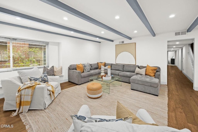 living room with beamed ceiling, recessed lighting, wood finished floors, and visible vents