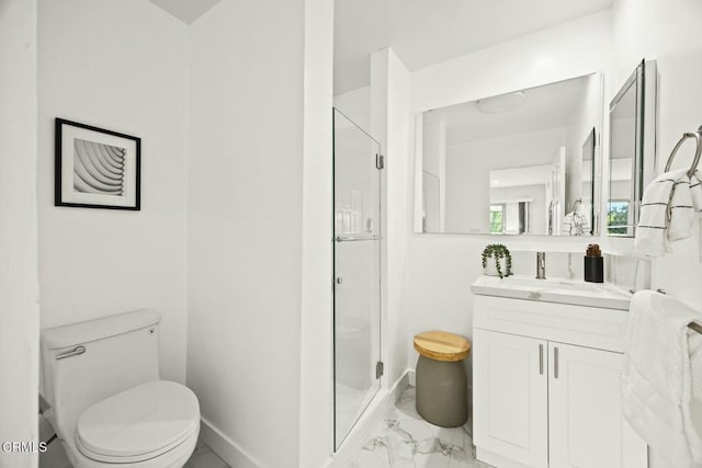 full bath with baseboards, toilet, a stall shower, marble finish floor, and vanity