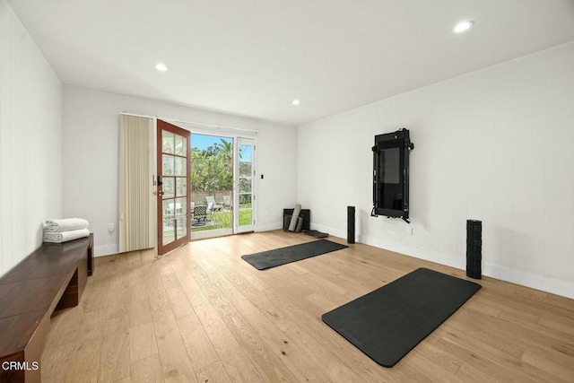 workout area featuring recessed lighting, baseboards, and wood finished floors