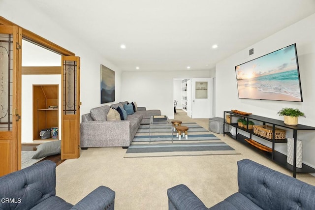 carpeted living room featuring visible vents and recessed lighting