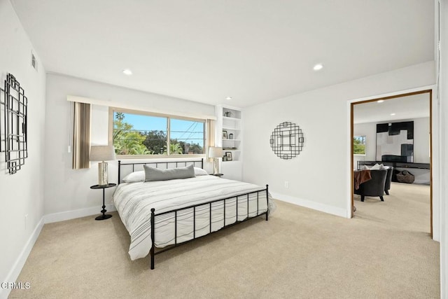 bedroom featuring light carpet, visible vents, recessed lighting, and baseboards