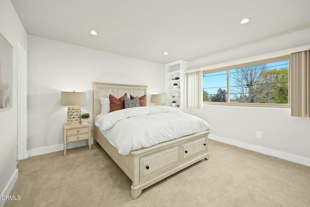 bedroom with recessed lighting, baseboards, and light colored carpet