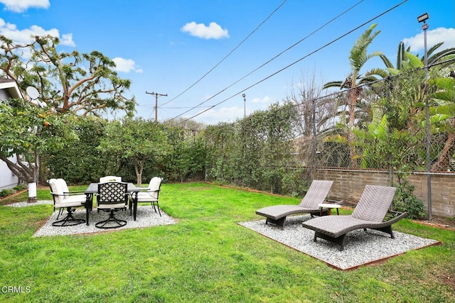 view of yard featuring a fenced backyard and a patio