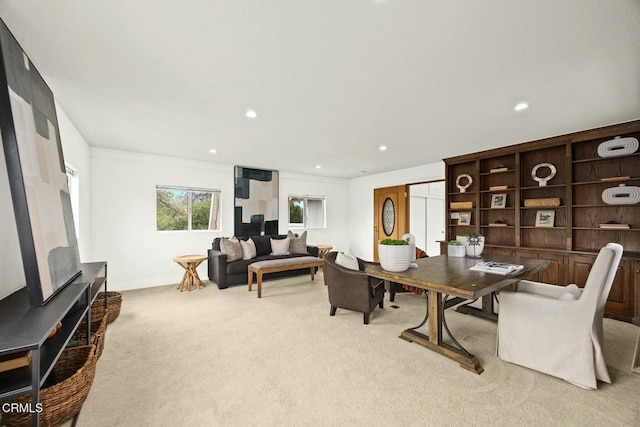 dining space with recessed lighting and light carpet