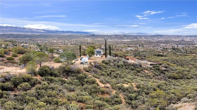 birds eye view of property featuring a mountain view