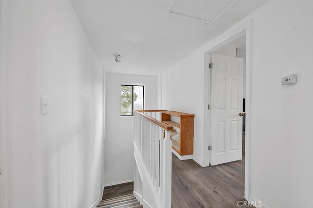 stairs featuring baseboards and wood finished floors