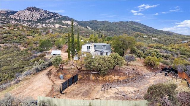 birds eye view of property with a mountain view