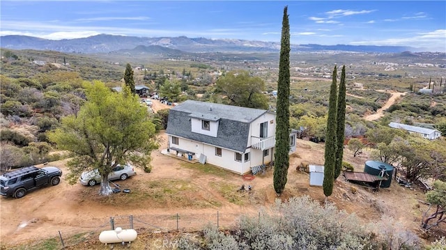 birds eye view of property featuring a mountain view