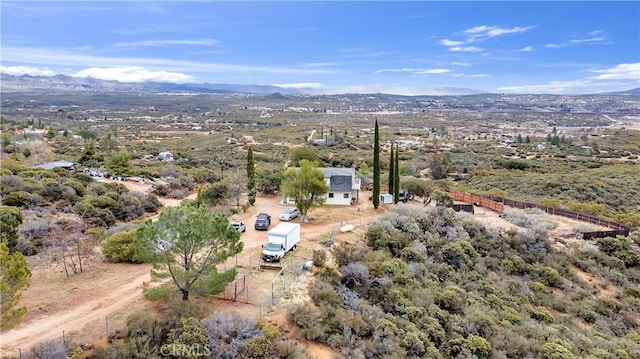 birds eye view of property with a mountain view