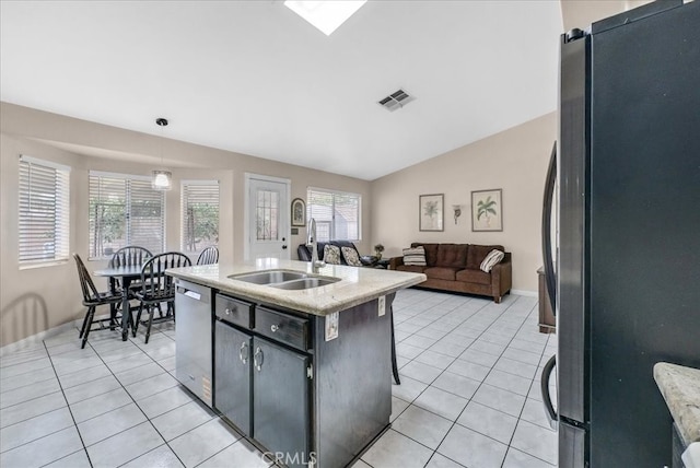 kitchen featuring a sink, visible vents, appliances with stainless steel finishes, and light tile patterned floors