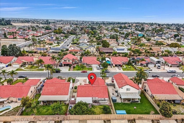 birds eye view of property with a residential view