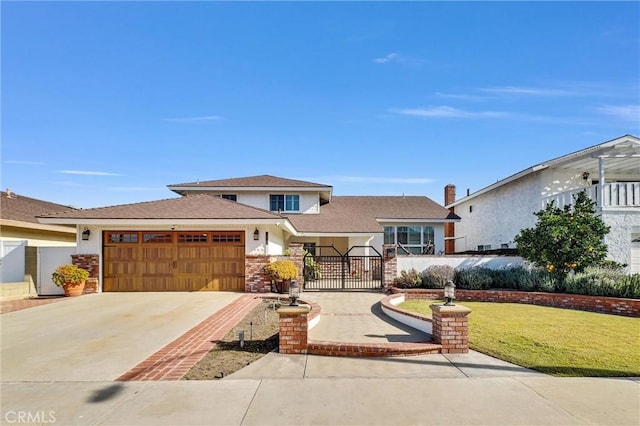 view of front of home with a front lawn, driveway, fence, a garage, and brick siding