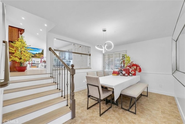 dining area with stairway, recessed lighting, baseboards, and an inviting chandelier