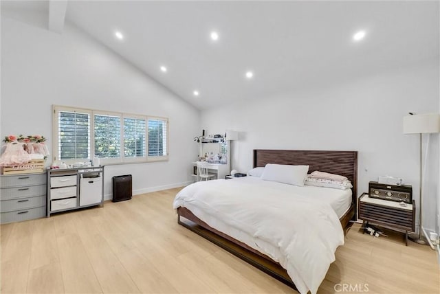 bedroom featuring recessed lighting, light wood-style flooring, and high vaulted ceiling