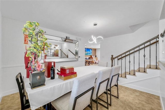 dining area with visible vents, baseboards, and stairs