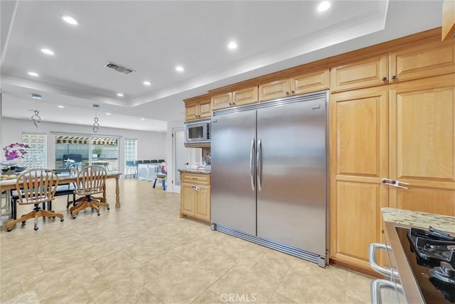 kitchen with visible vents, built in appliances, light stone counters, recessed lighting, and a raised ceiling