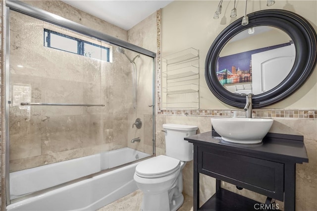 1316 Edgewood Dr, Alhambra, CA 91803 - full bath featuring combined bath / shower with glass door, toilet, vanity, and tile walls