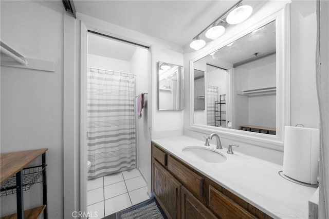 full bathroom with tile patterned floors, curtained shower, and vanity