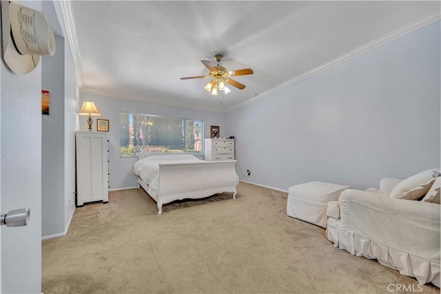 bedroom featuring carpet flooring, baseboards, crown molding, and a ceiling fan