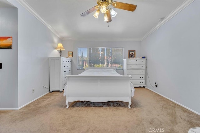 bedroom featuring crown molding, a ceiling fan, baseboards, and light carpet