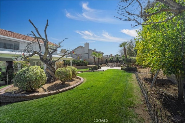 view of yard with a fenced backyard and a patio