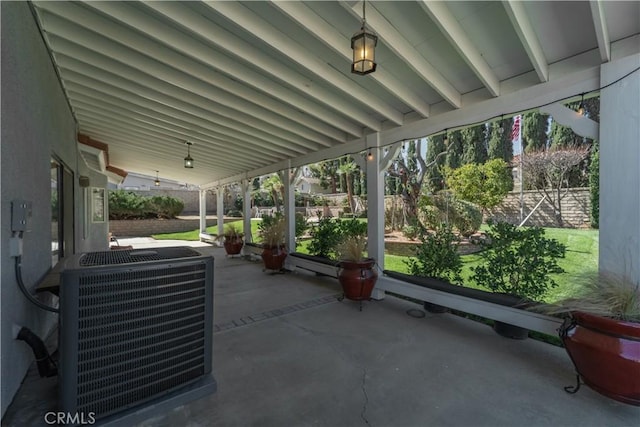 view of patio with cooling unit and fence