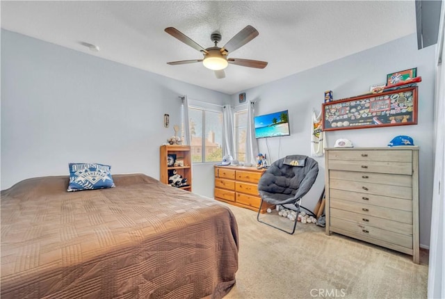 carpeted bedroom with a ceiling fan