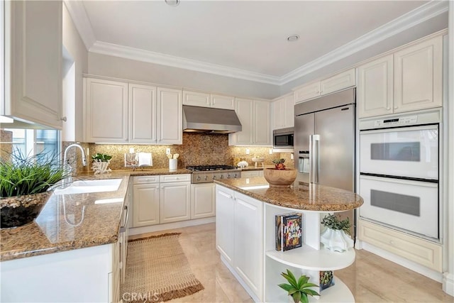 kitchen featuring a sink, crown molding, under cabinet range hood, built in appliances, and open shelves