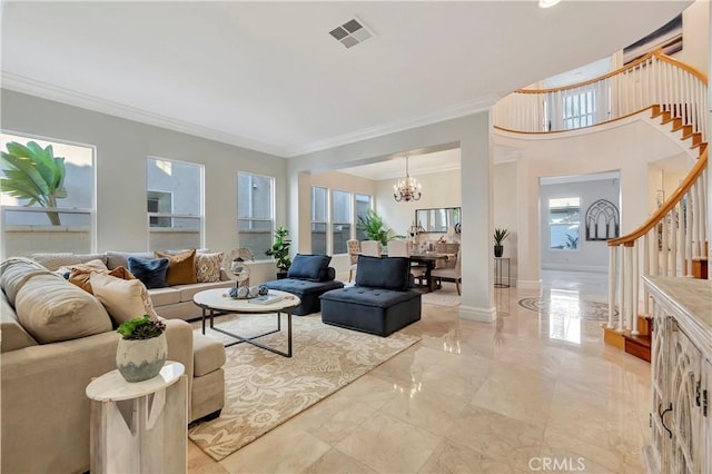 living room with a notable chandelier, visible vents, stairway, and baseboards