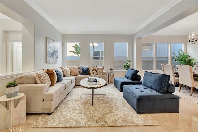 living area with crown molding and a chandelier