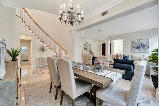 dining room with visible vents, stairway, crown molding, baseboards, and a chandelier