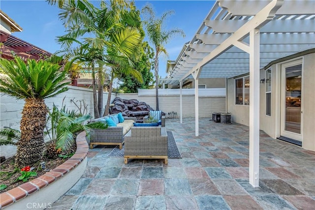 view of patio with an outdoor hangout area, a fenced backyard, and a pergola