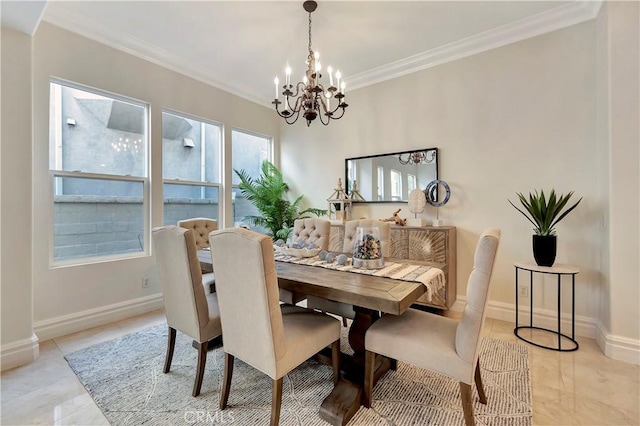 dining room featuring baseboards, a chandelier, and crown molding