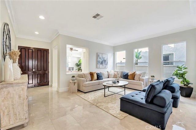 living room with a wealth of natural light, baseboards, and ornamental molding