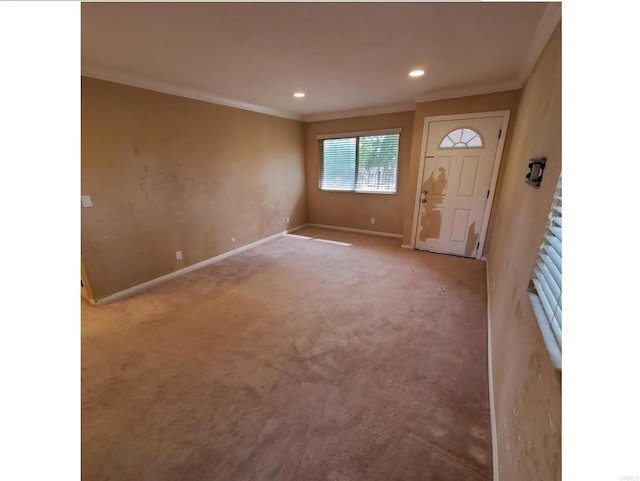 carpeted entryway featuring recessed lighting, baseboards, and ornamental molding