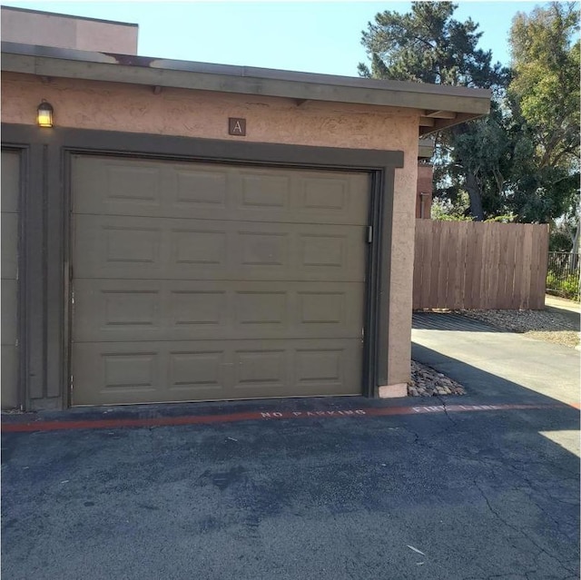 garage with fence