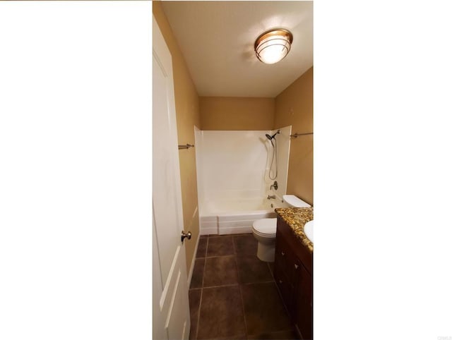 full bath with vanity, tile patterned floors, toilet, and shower / bathing tub combination