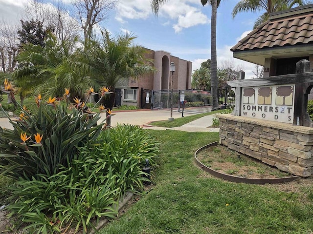 exterior space featuring fence and a gate