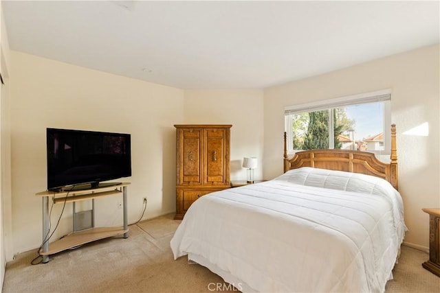 bedroom with light carpet