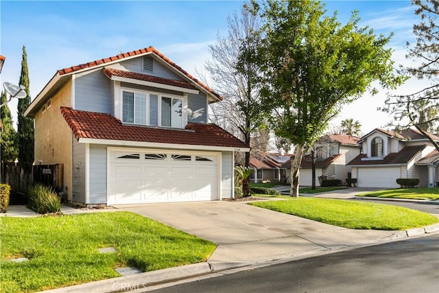 view of front of house with a front yard, concrete driveway, an attached garage, and a tile roof