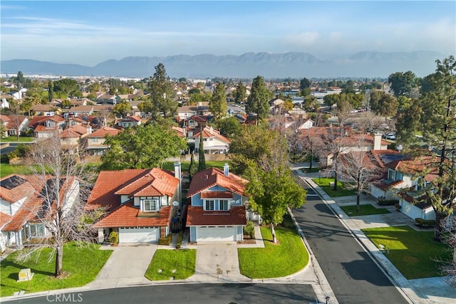 drone / aerial view featuring a mountain view and a residential view