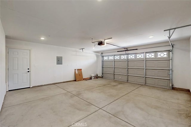 garage featuring electric panel, recessed lighting, a garage door opener, and baseboards