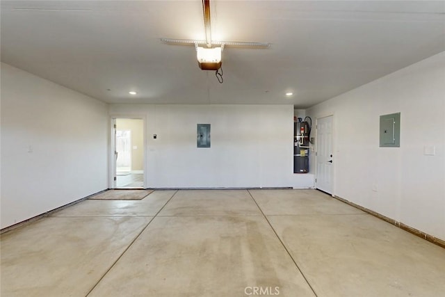 garage with recessed lighting, electric panel, a garage door opener, and baseboards