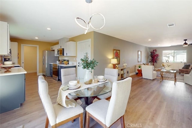 dining area featuring recessed lighting, light wood-style floors, visible vents, and baseboards
