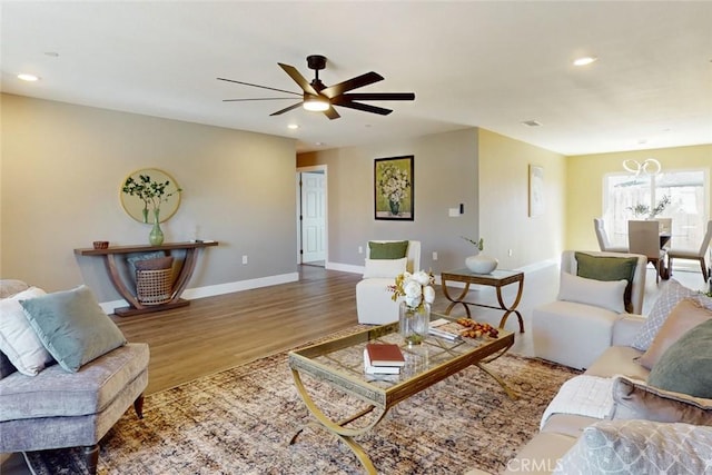 living room featuring recessed lighting, wood finished floors, baseboards, and ceiling fan