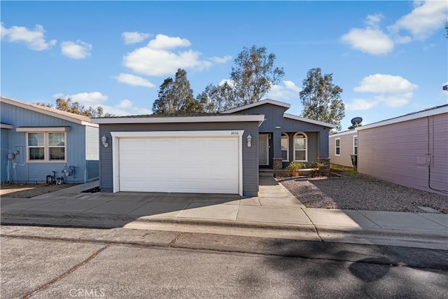 view of front of property featuring driveway and an attached garage