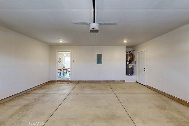 garage featuring electric panel and a garage door opener