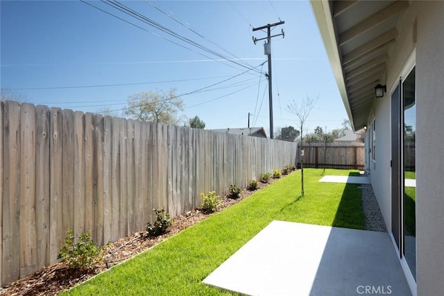 view of yard featuring a patio area and a fenced backyard