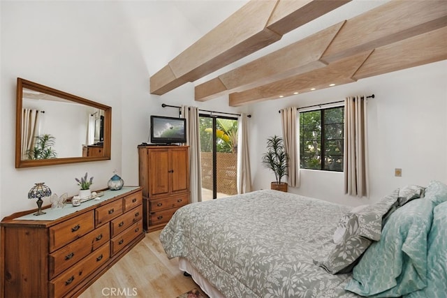 bedroom with access to outside, light wood-style floors, and beamed ceiling