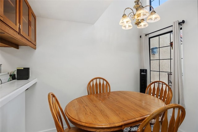 dining area featuring a notable chandelier